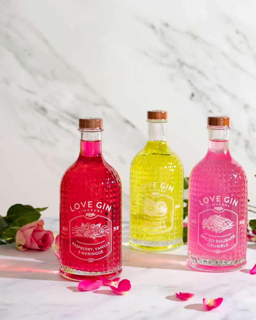 Attractive Gin bottles with roses in the background
